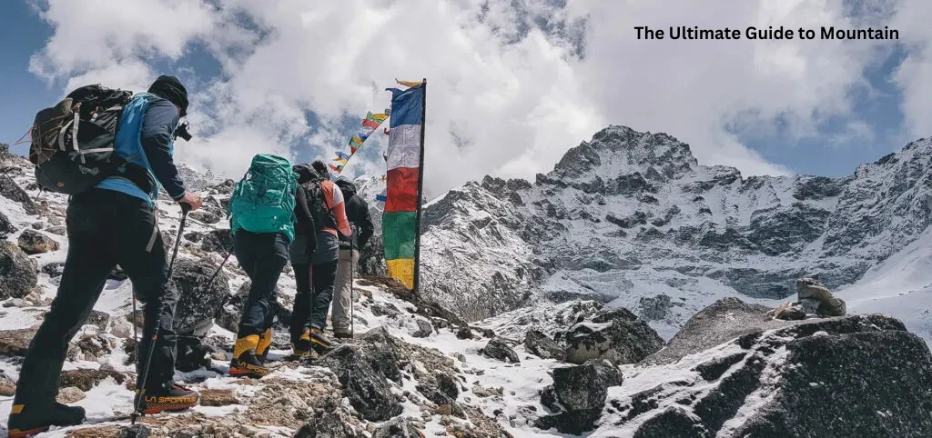 Mountain photography beginners guide — hikers climbing a snowy mountain trail under bright sky with prayer flags.